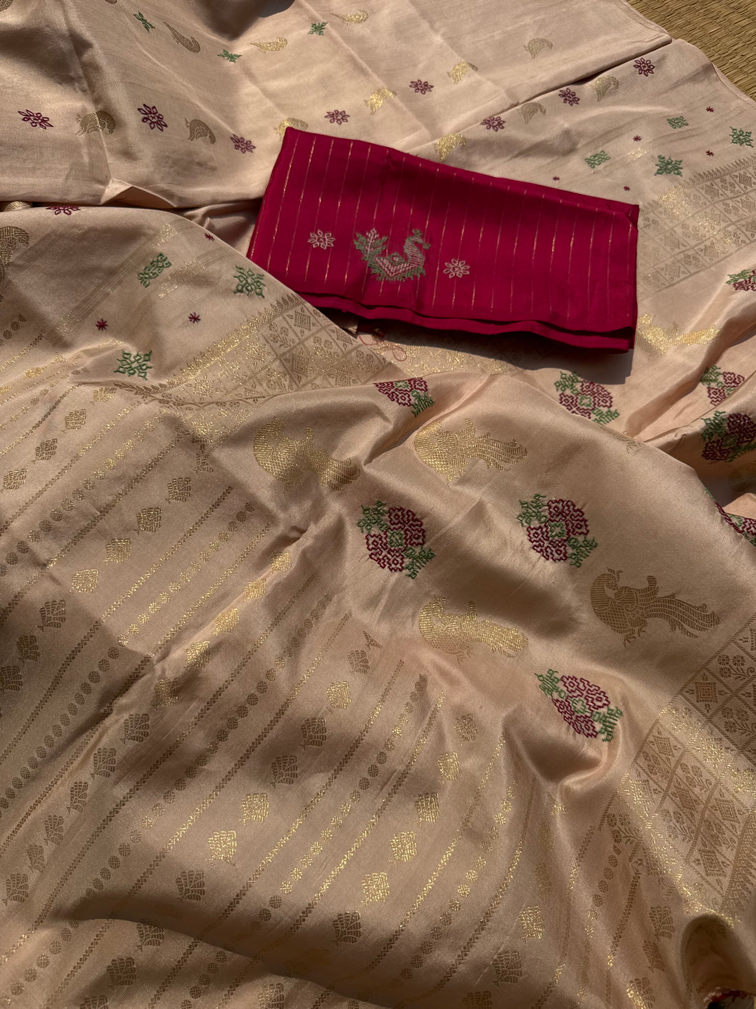 A designer exclusive almond shaded borderless kanchivaram silk saree With hand embroidered kasuti work