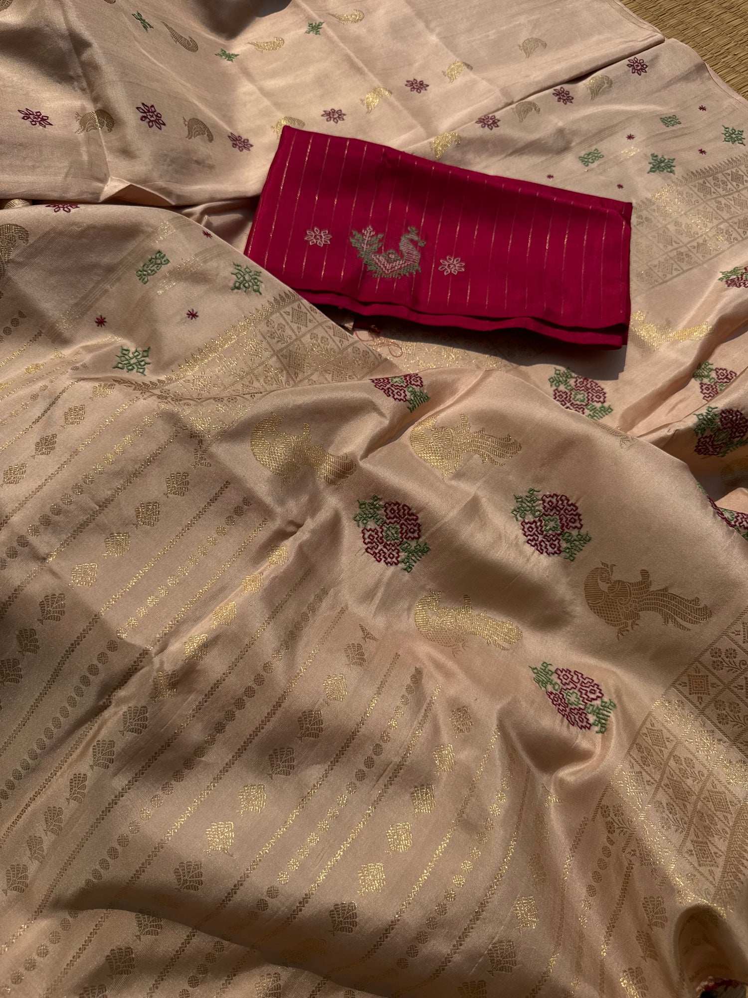 A designer exclusive almond shaded borderless kanchivaram silk saree With hand embroidered kasuti work