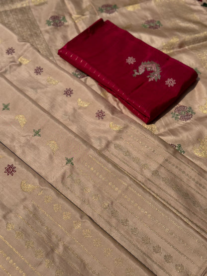 A designer exclusive almond shaded borderless kanchivaram silk saree With hand embroidered kasuti work