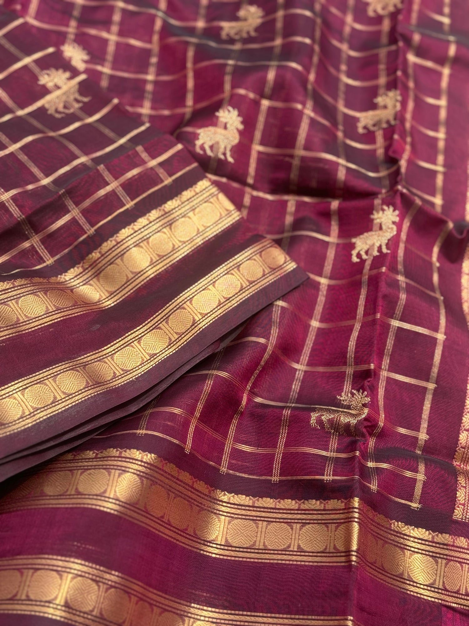 A gorgeous burgundy shade handwoven zari checks with deer motifs Kanchi  silk cotton saree