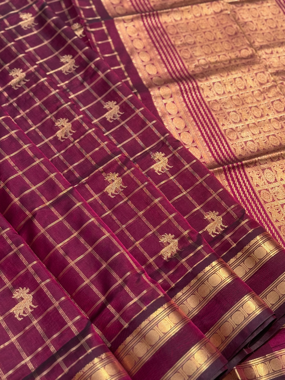 A gorgeous burgundy shade handwoven zari checks with deer motifs Kanchi silk cotton saree