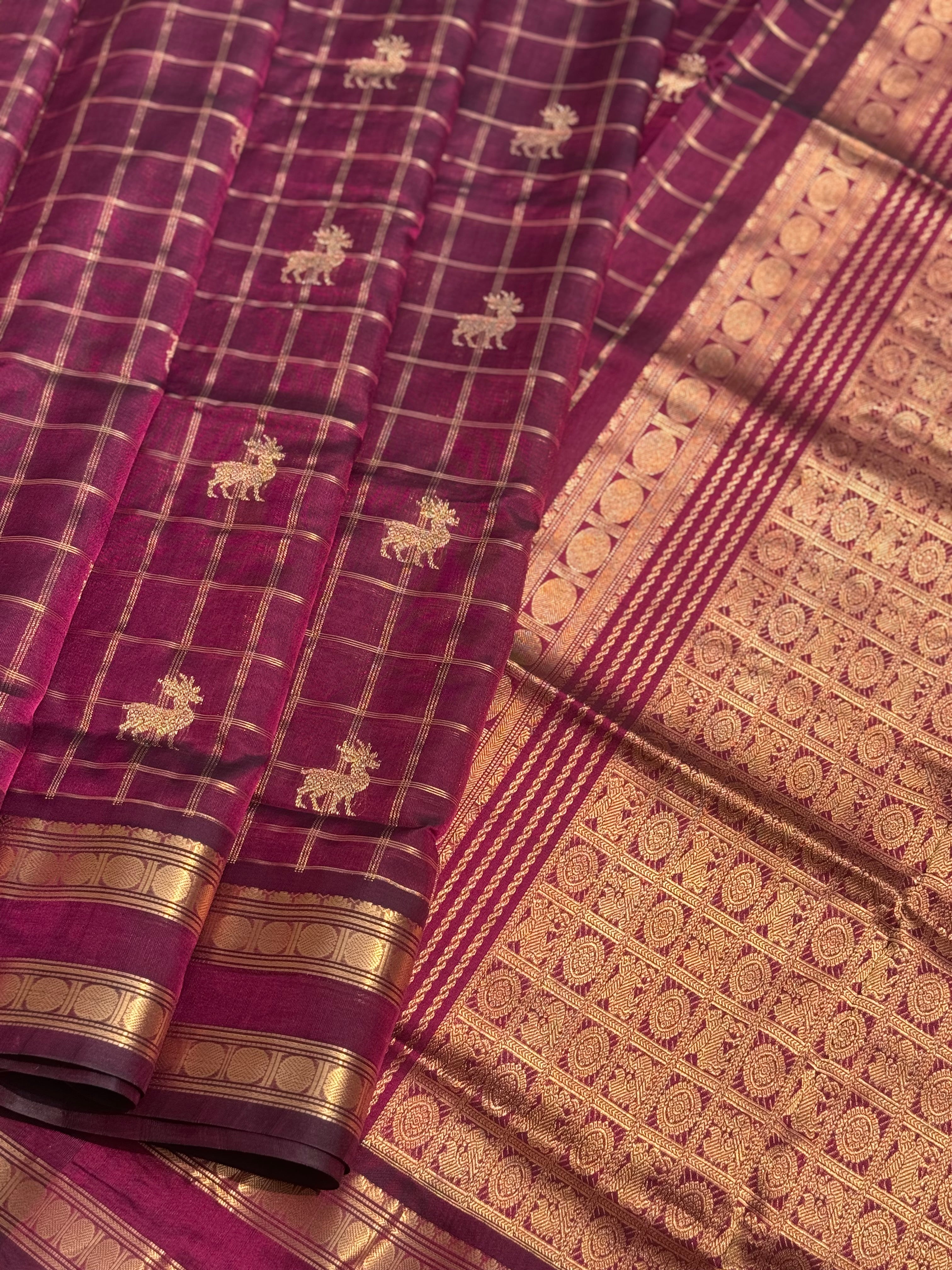 A gorgeous burgundy shade handwoven zari checks with deer motifs Kanchi  silk cotton saree