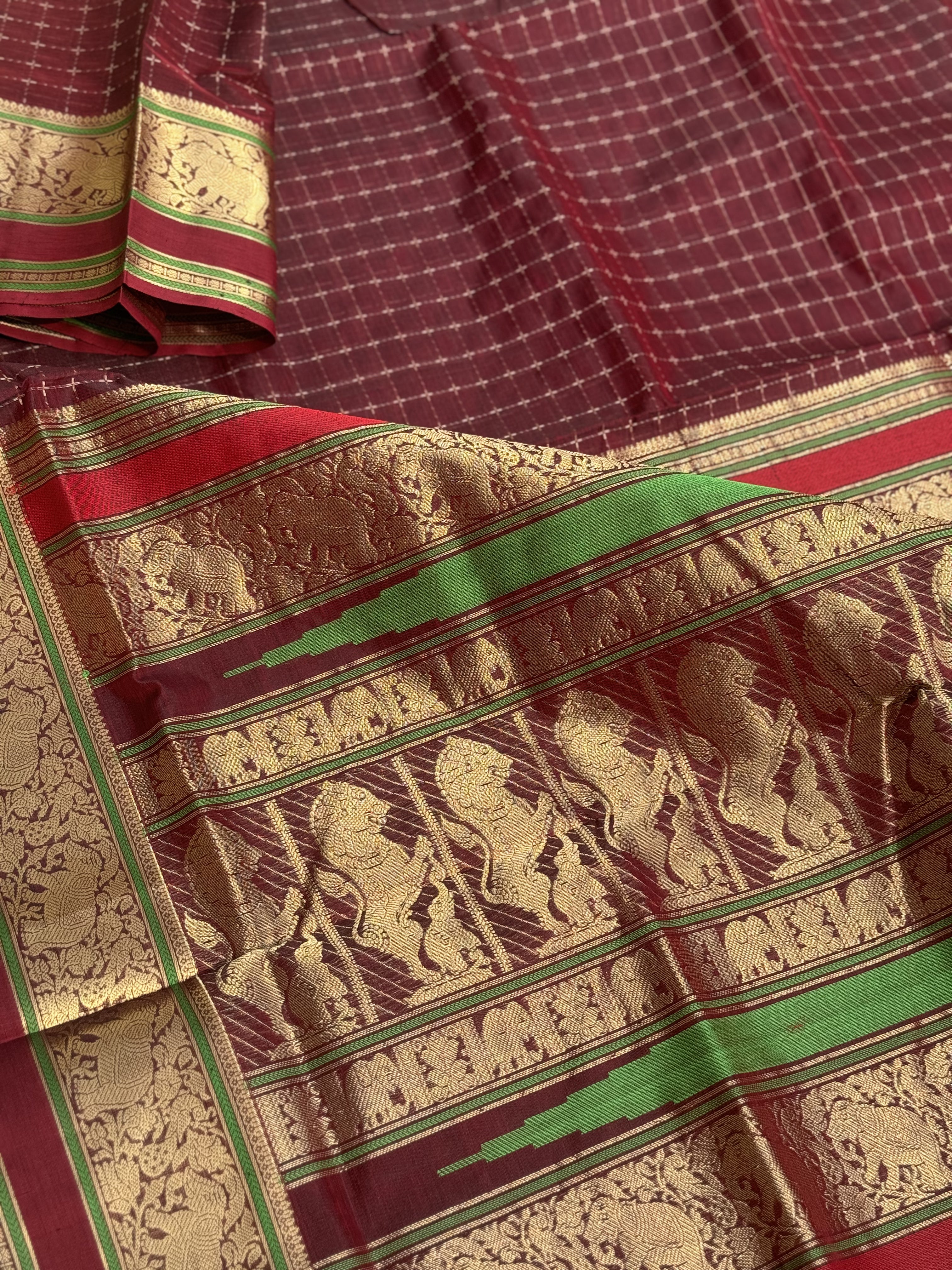 A gorgeous burgundy shade handwoven plus buttas  silk cotton saree