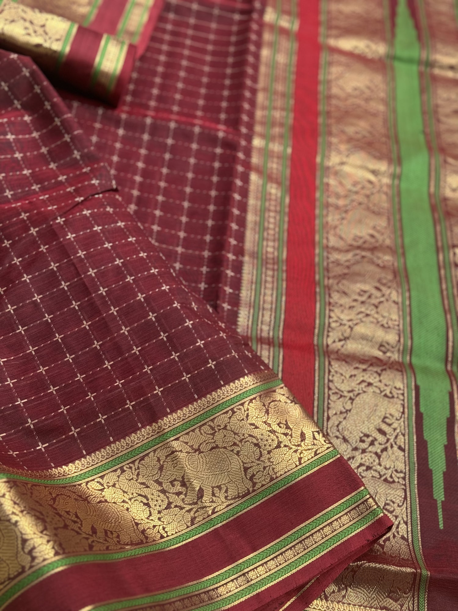 A gorgeous burgundy shade handwoven plus buttas  silk cotton saree