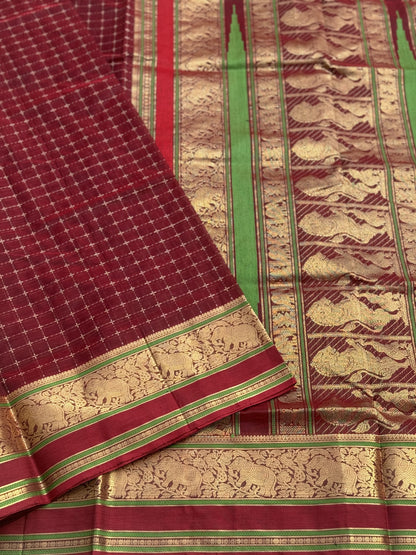 A gorgeous burgundy shade handwoven plus buttas  silk cotton saree