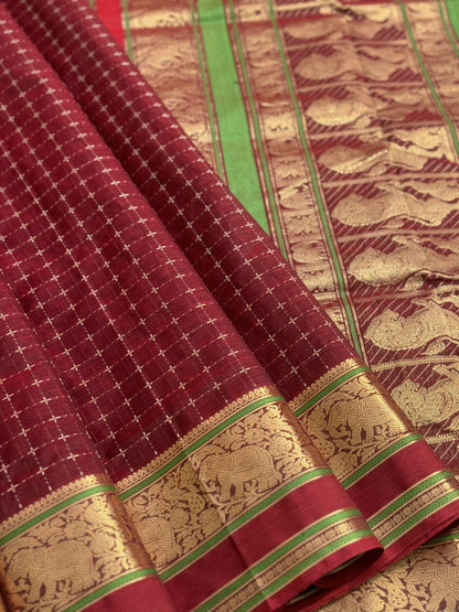 A gorgeous burgundy shade handwoven plus buttas  silk cotton saree