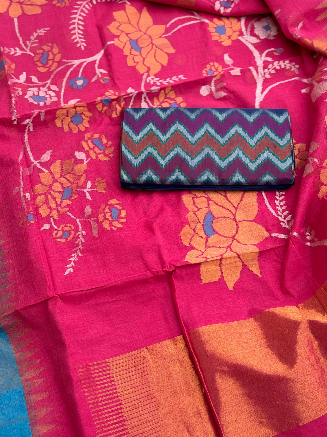 A gorgeous pink with blue Ponduru khadi Jaal jamdani saree