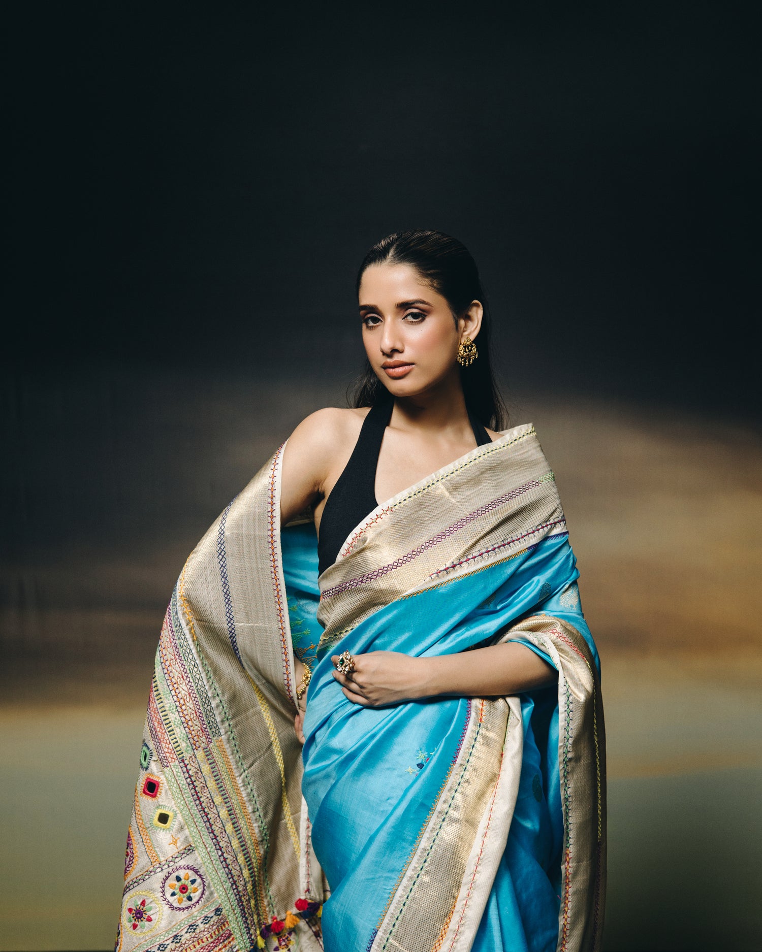 handwoven pure kanchivaram silk saree with korvai borders adorned with an exquisite handmade lambani mirror work
