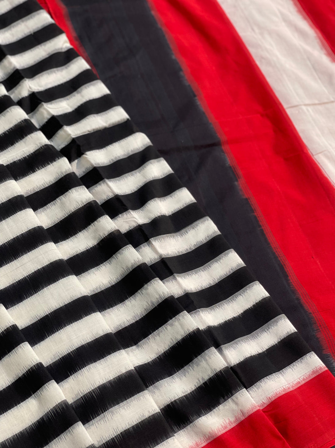 A Contemporary style striped double Ikkat cotton saree