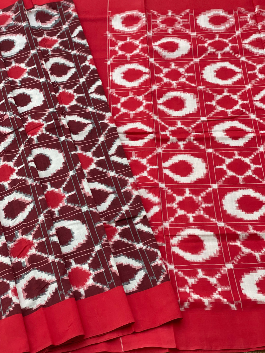 A traditional style Telia Rumal double ikkat cotton saree, with sun moon pattern