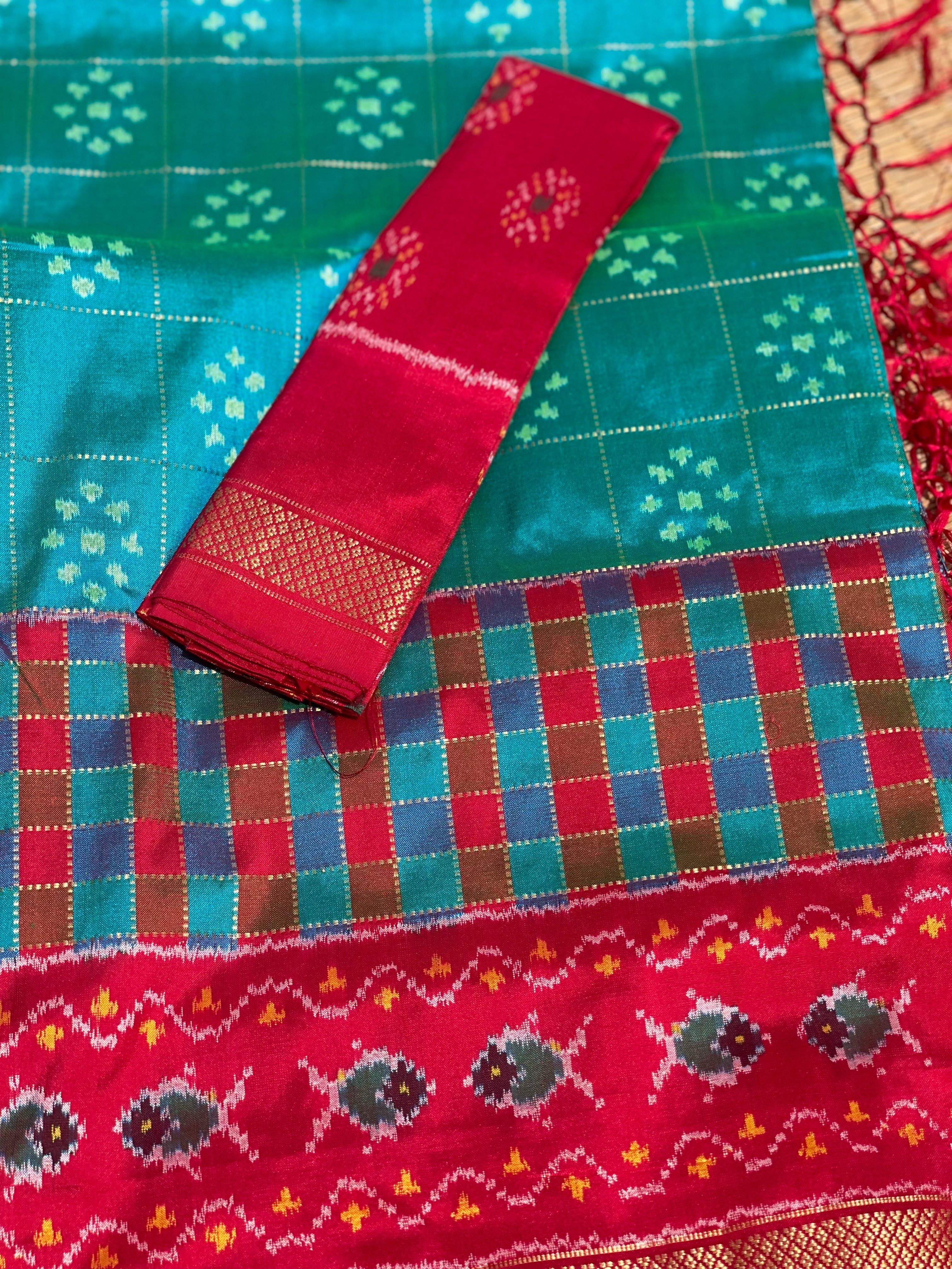 A Resplendent peacock green silk ikkat saree with vintage kanchivaram Pettu border