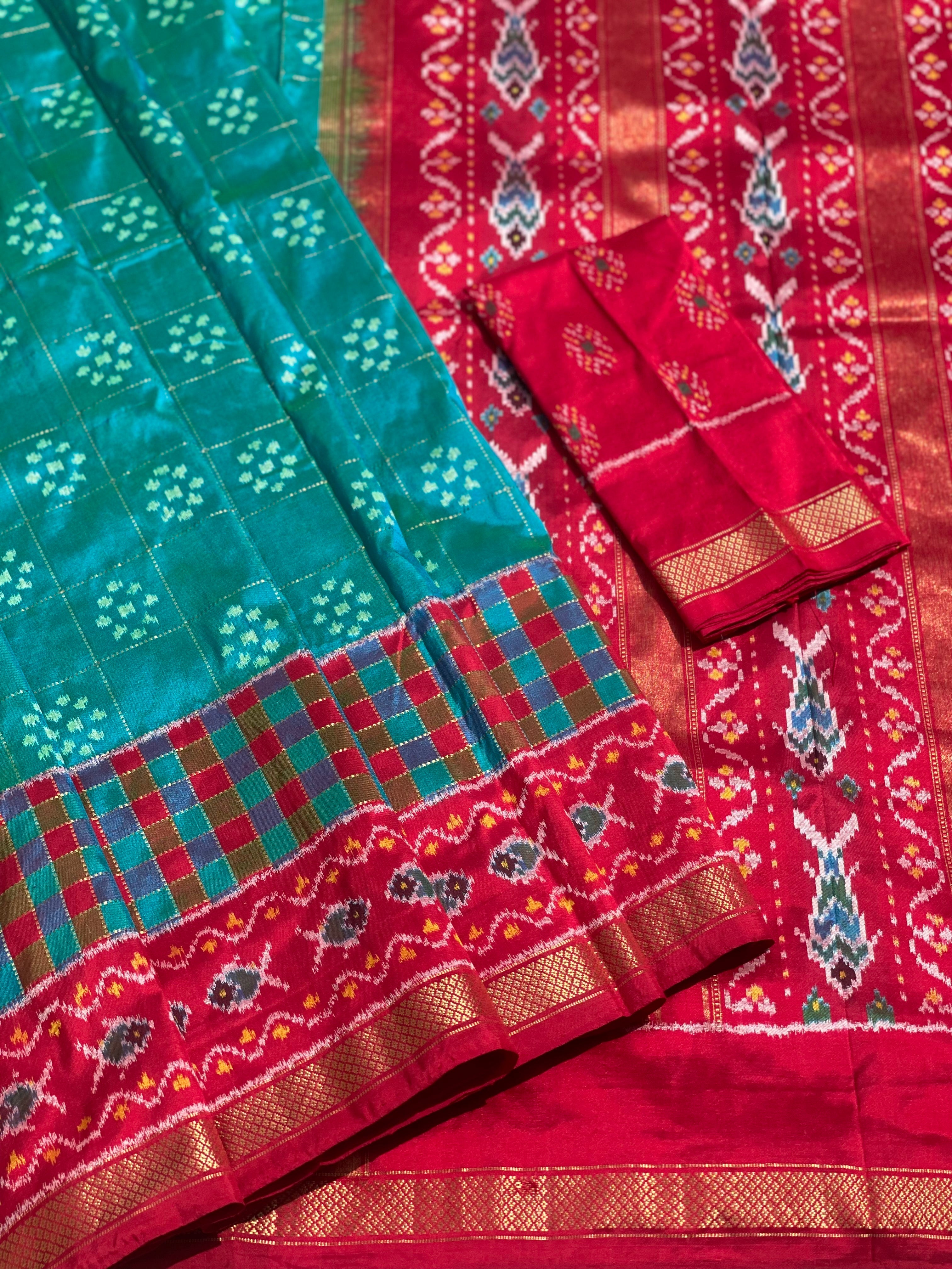 A Resplendent peacock green silk ikkat saree with vintage kanchivaram Pettu border