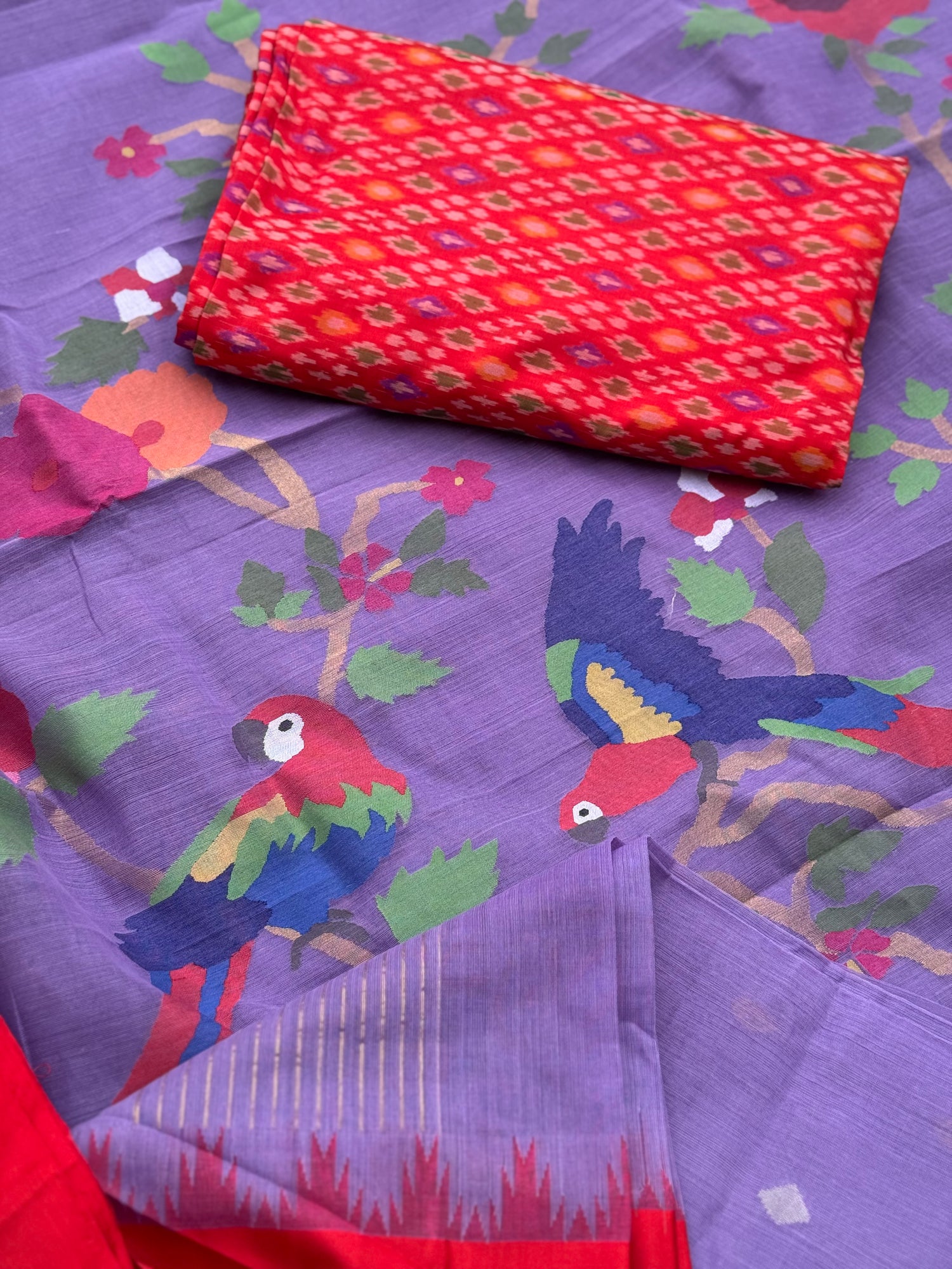 A gorgeous lilac with red shade handspun ponduru Khadhi jamdani cotton saree