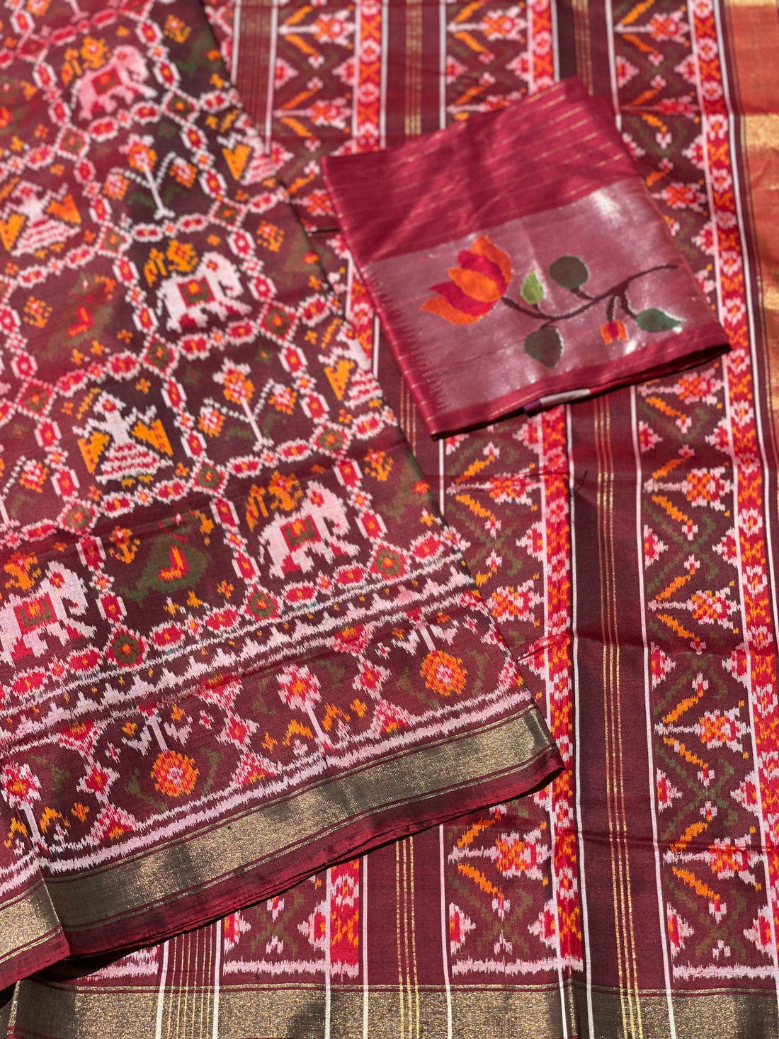 Deep burgundy Rajkot semi double ikkat Patola silk saree