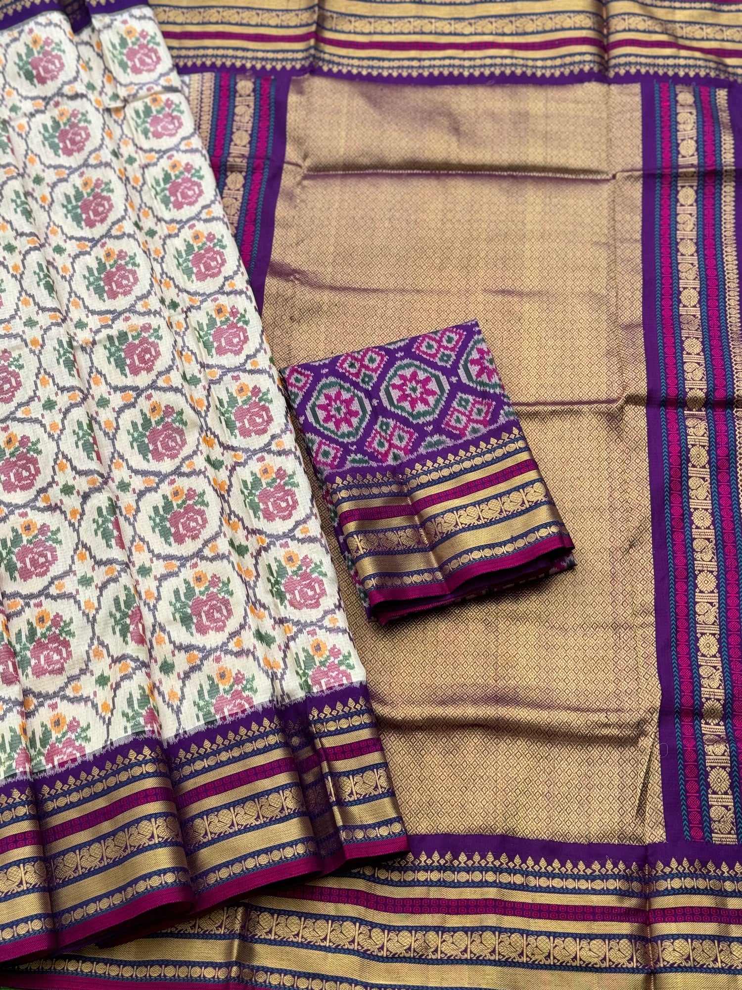 A masterpiece ivory with purple roses patola inspired ikkat with kanchi fusion pure handwoven silk saree