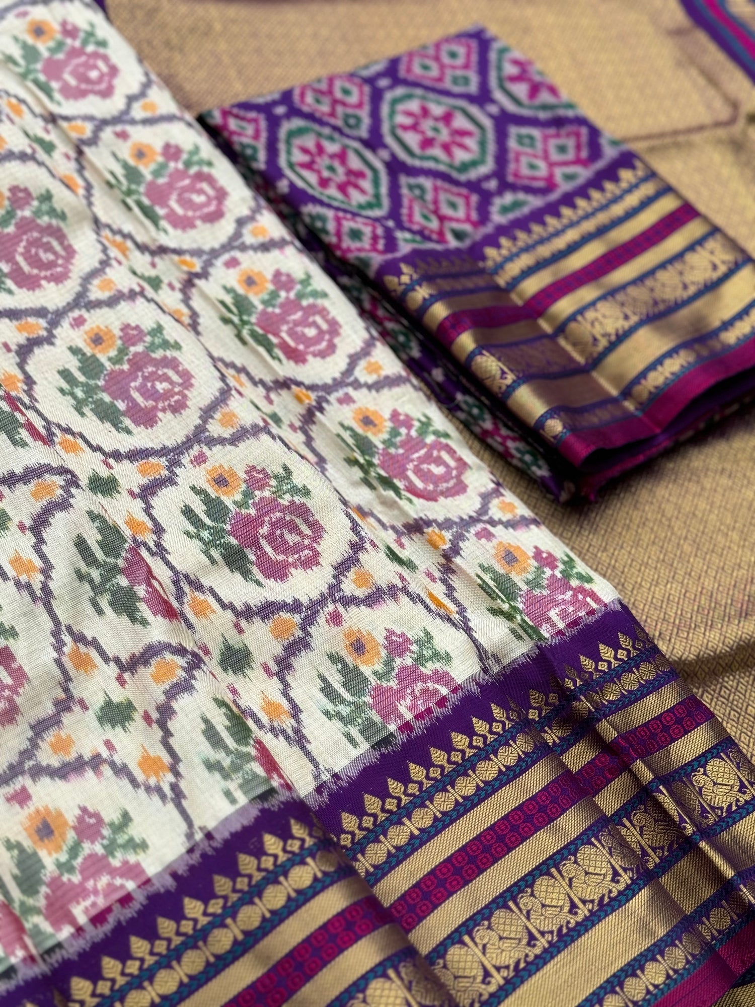 A masterpiece ivory with purple roses patola inspired ikkat with kanchi fusion pure handwoven silk saree