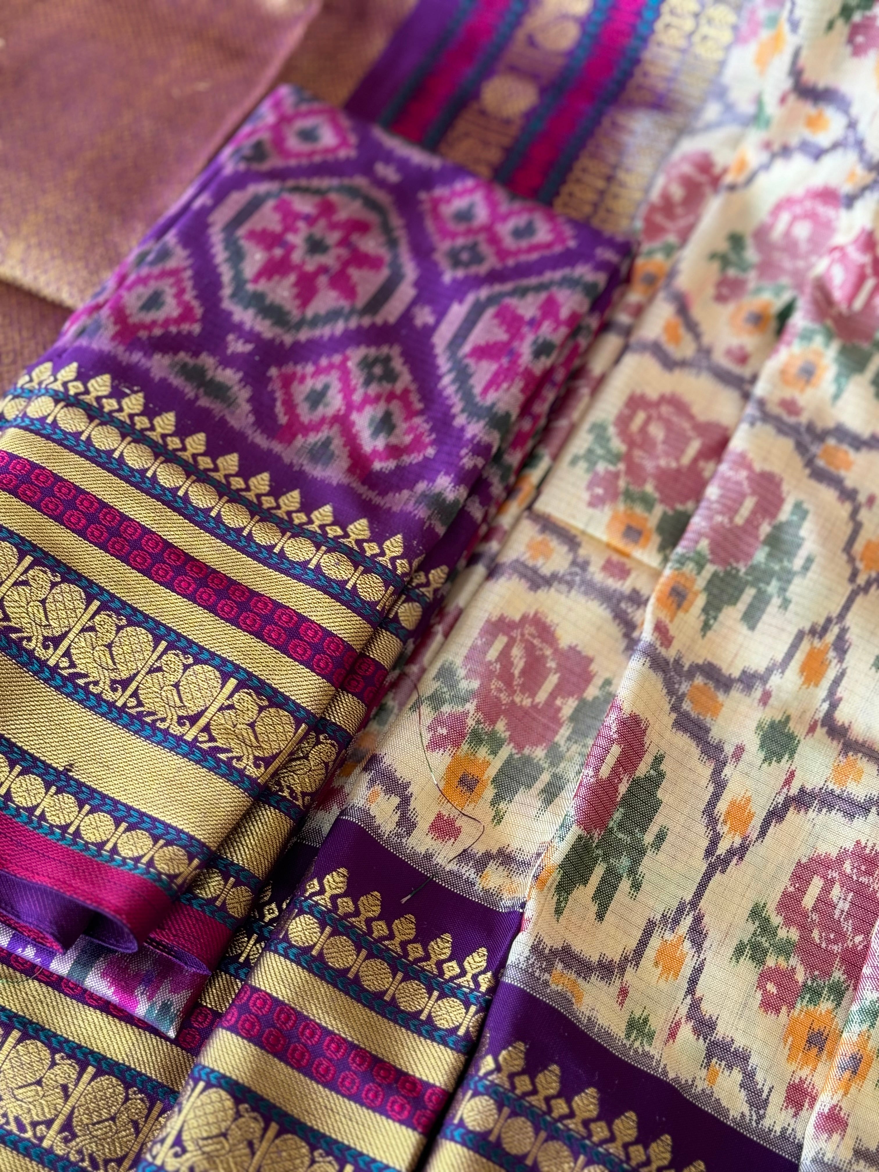 A masterpiece ivory with purple roses patola inspired ikkat with kanchi fusion pure handwoven silk saree