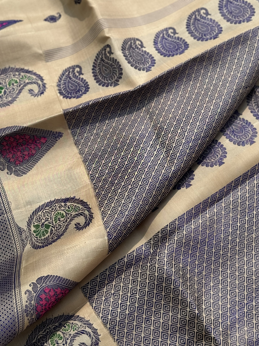 A gorgeous No Zari ivory with lavender with pink handwoven soft and lustrous gadwal silk saree