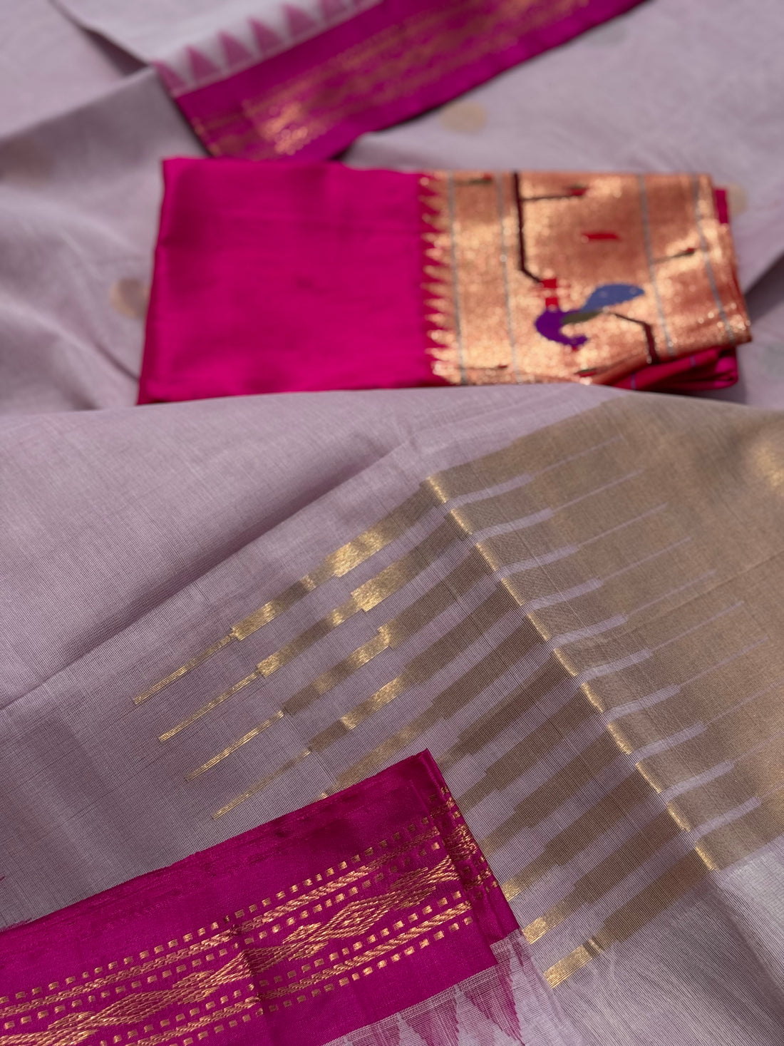 Handspun and handwoven ponduru Khadhi cotton jamdani saree with silk border in contrast pink and lilac jacquard weave