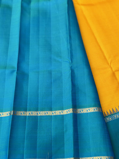 A gorgeous peacock blue with mustard yellow korvai border kanchivaram silk SAREE