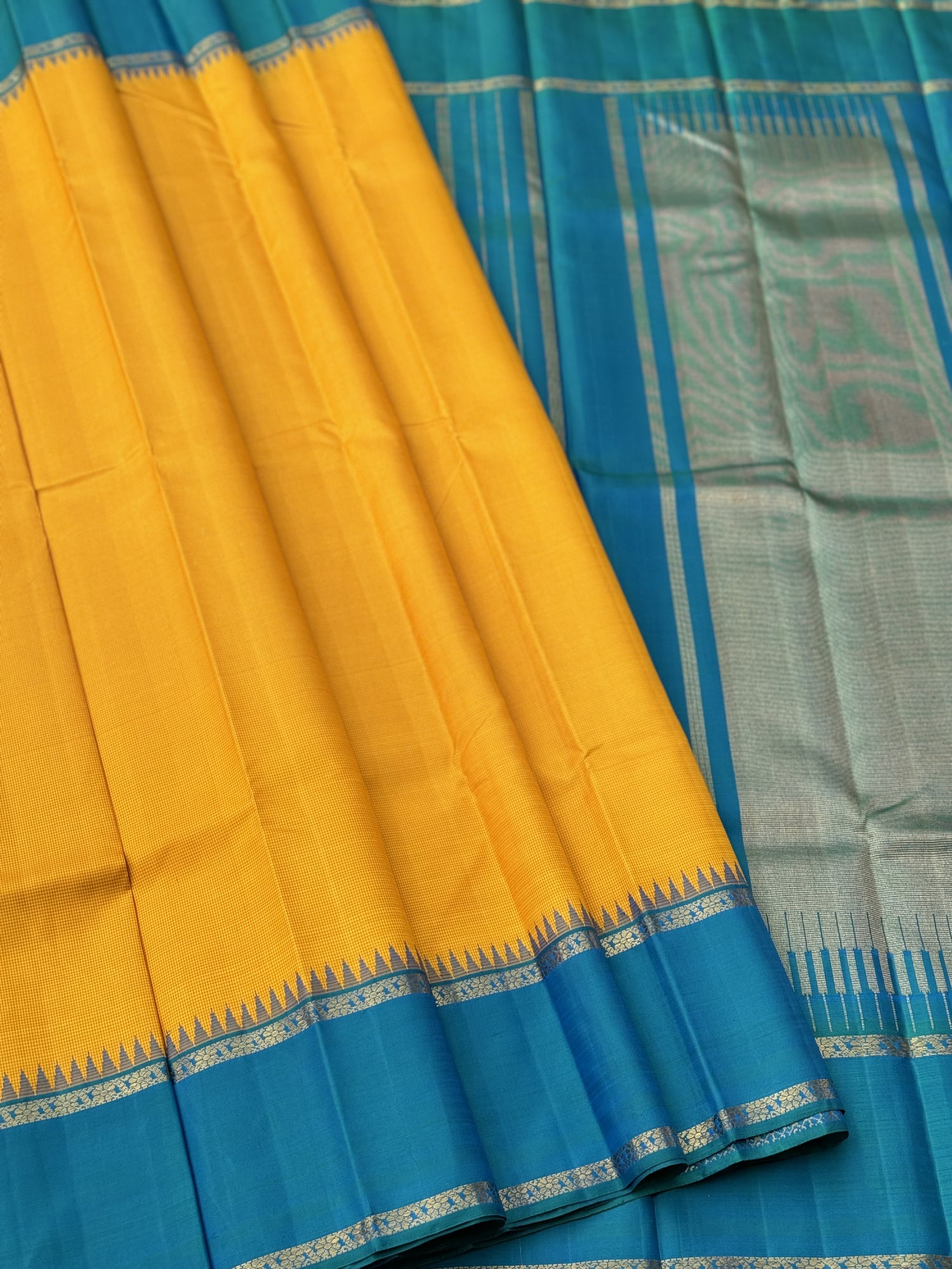 A gorgeous peacock blue with mustard yellow korvai border kanchivaram silk SAREE