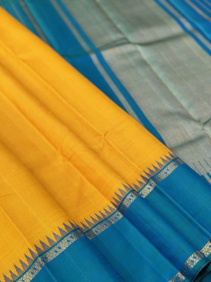 A gorgeous peacock blue with mustard yellow korvai border kanchivaram silk SAREE