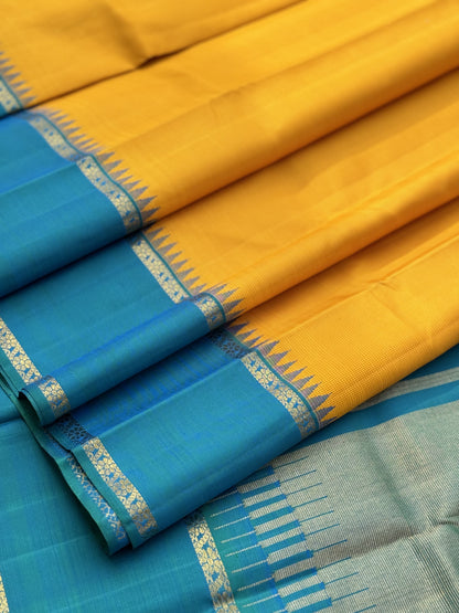 A gorgeous peacock blue with mustard yellow korvai border kanchivaram silk SAREE