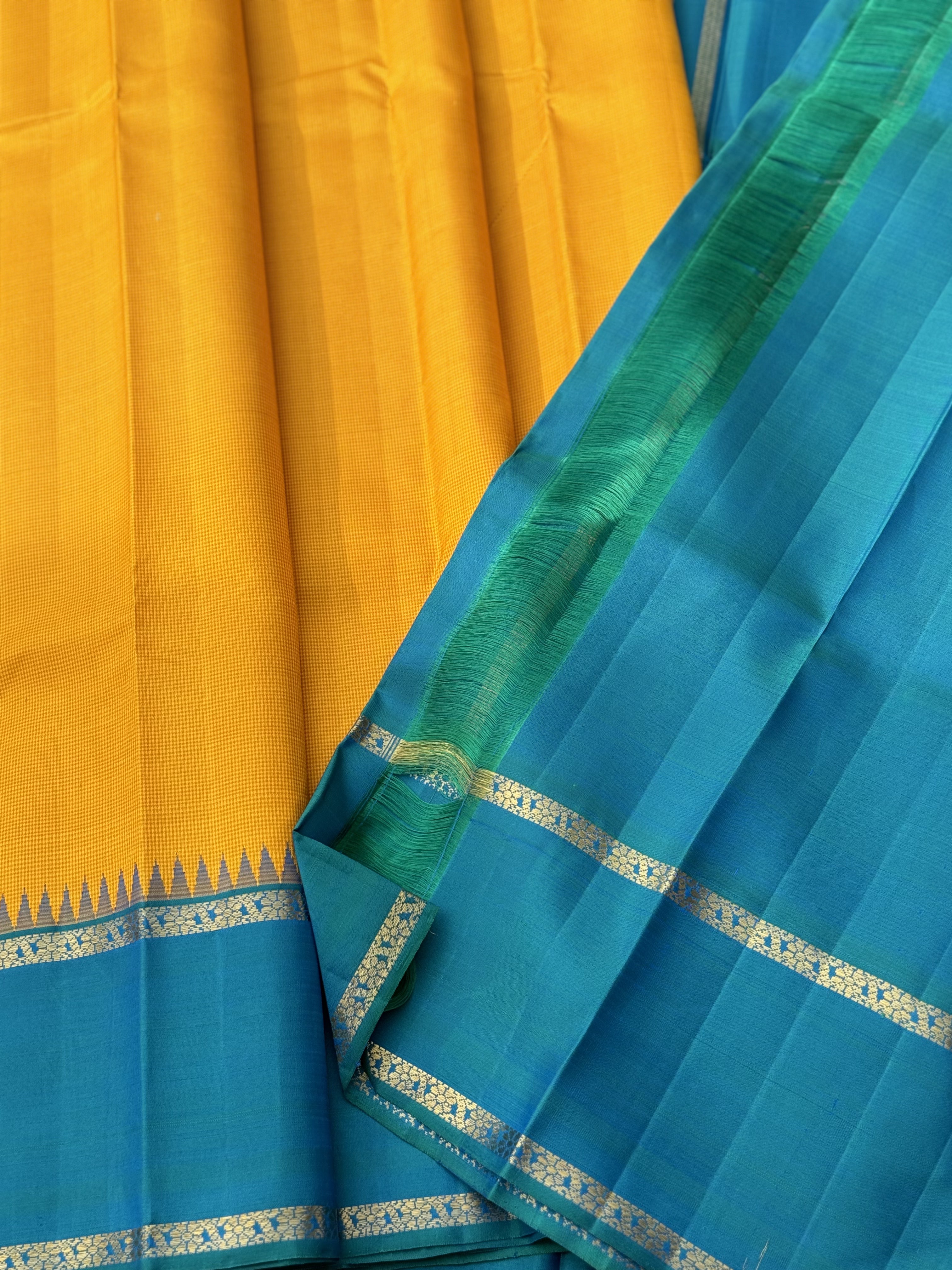 A gorgeous peacock blue with mustard yellow korvai border kanchivaram silk SAREE