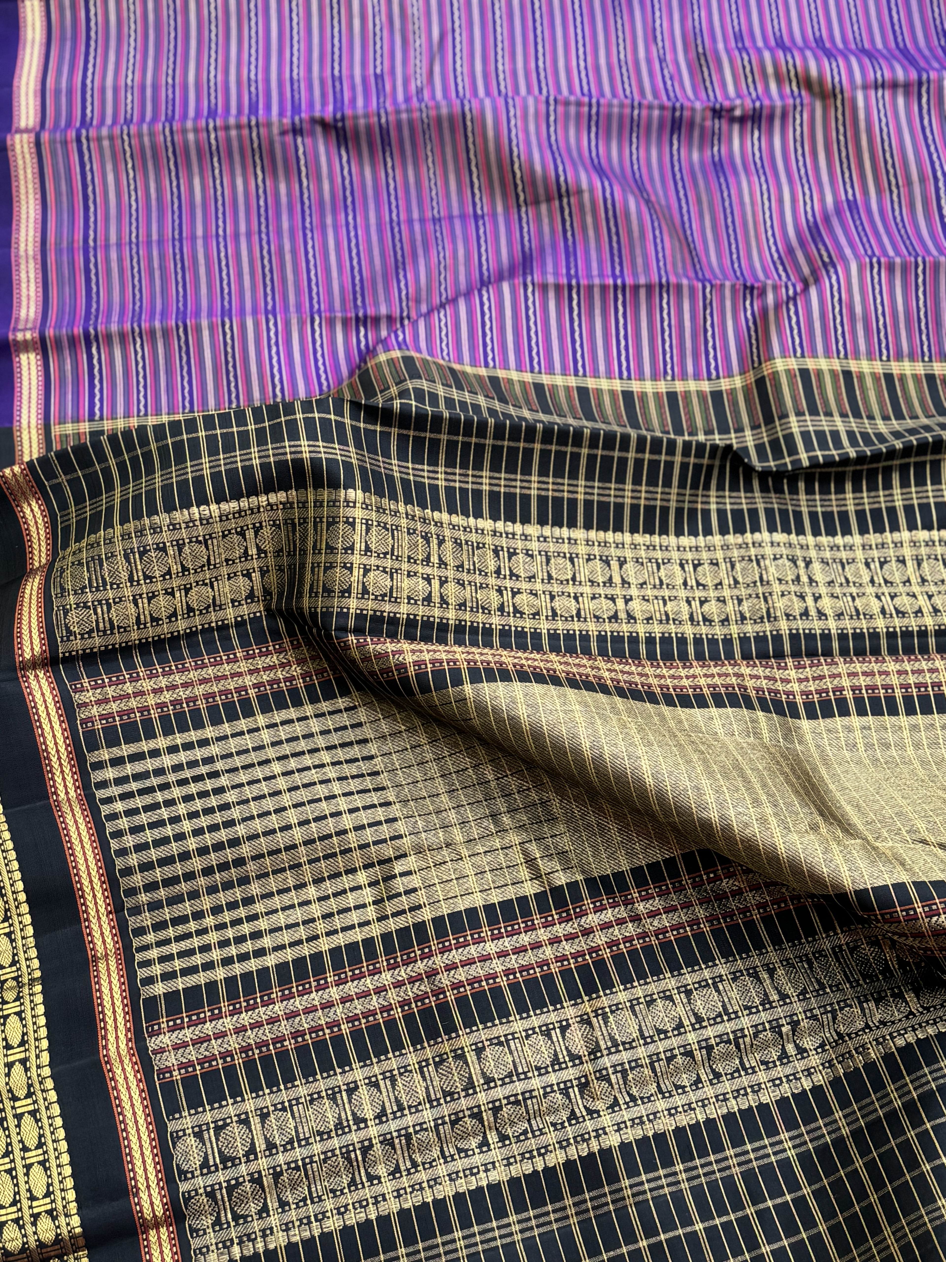 A stunner varisaipettu kanchivaram silk saree in purple with black