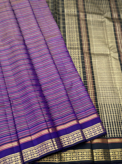 A stunner varisaipettu kanchivaram silk saree in purple with black