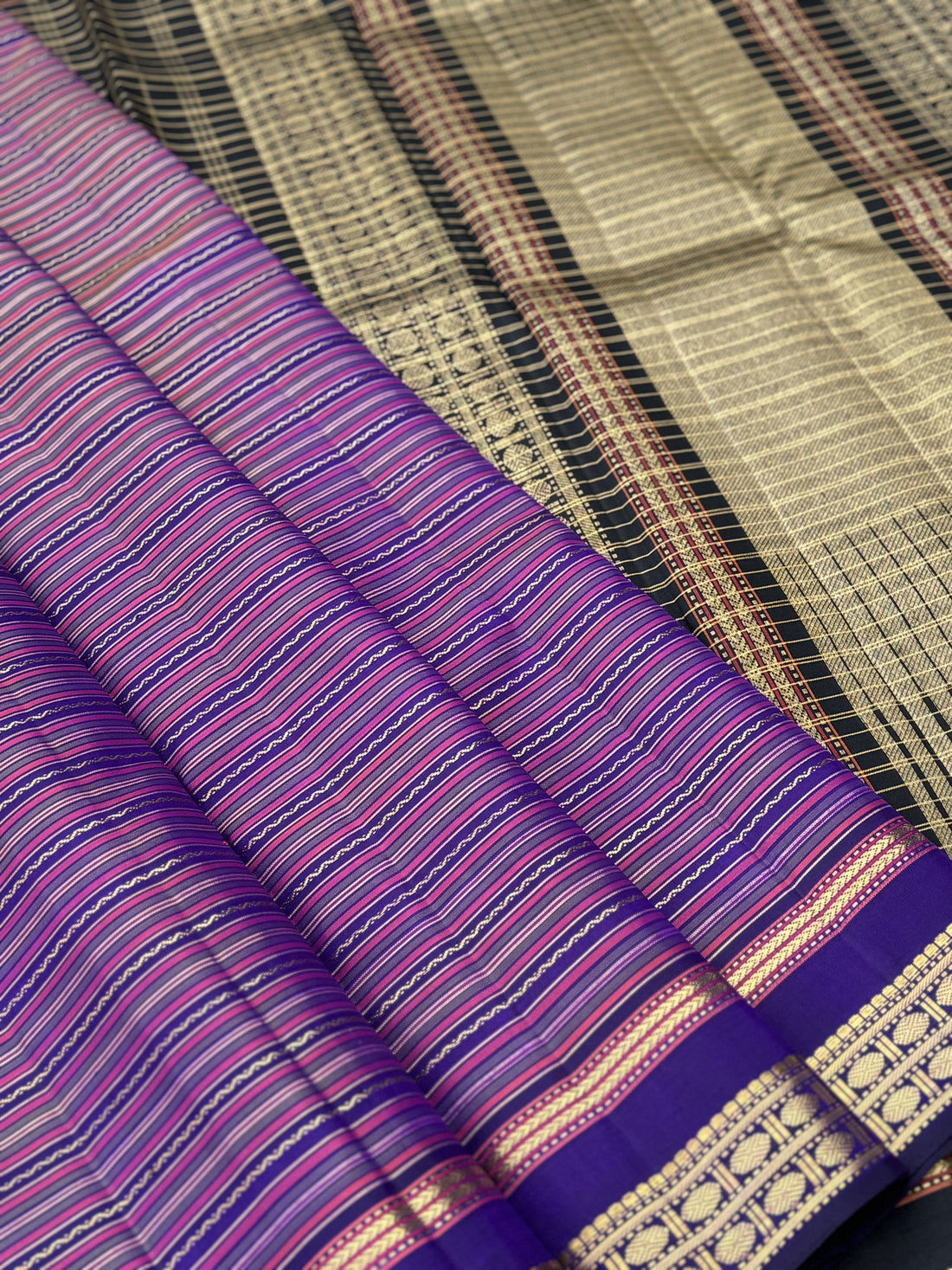 A stunner varisaipettu kanchivaram silk saree in purple with black