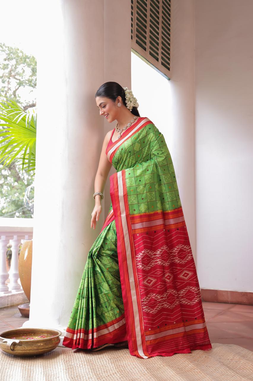 A Fern Green shade revival vintage recreated masterpiece created by a national award winning masterweaver, a highly skilled craftsmanship silk ikkat saree