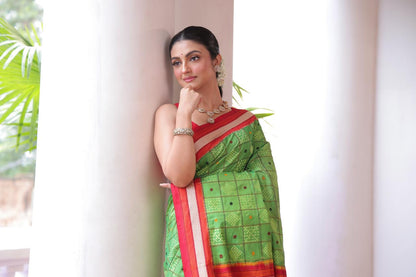 A Fern Green shade revival vintage recreated masterpiece created by a national award winning masterweaver, a highly skilled craftsmanship silk ikkat saree
