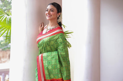 A Fern Green shade revival vintage recreated masterpiece created by a national award winning masterweaver, a highly skilled craftsmanship silk ikkat saree