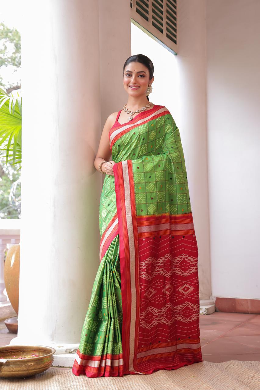A Fern Green shade revival vintage recreated masterpiece created by a national award winning masterweaver, a highly skilled craftsmanship silk ikkat saree