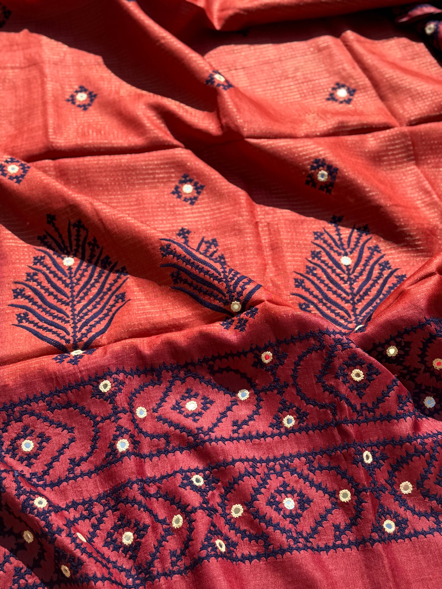 Brick red handwoven Tussar silk saree with handmade kutch mirror embroidery work