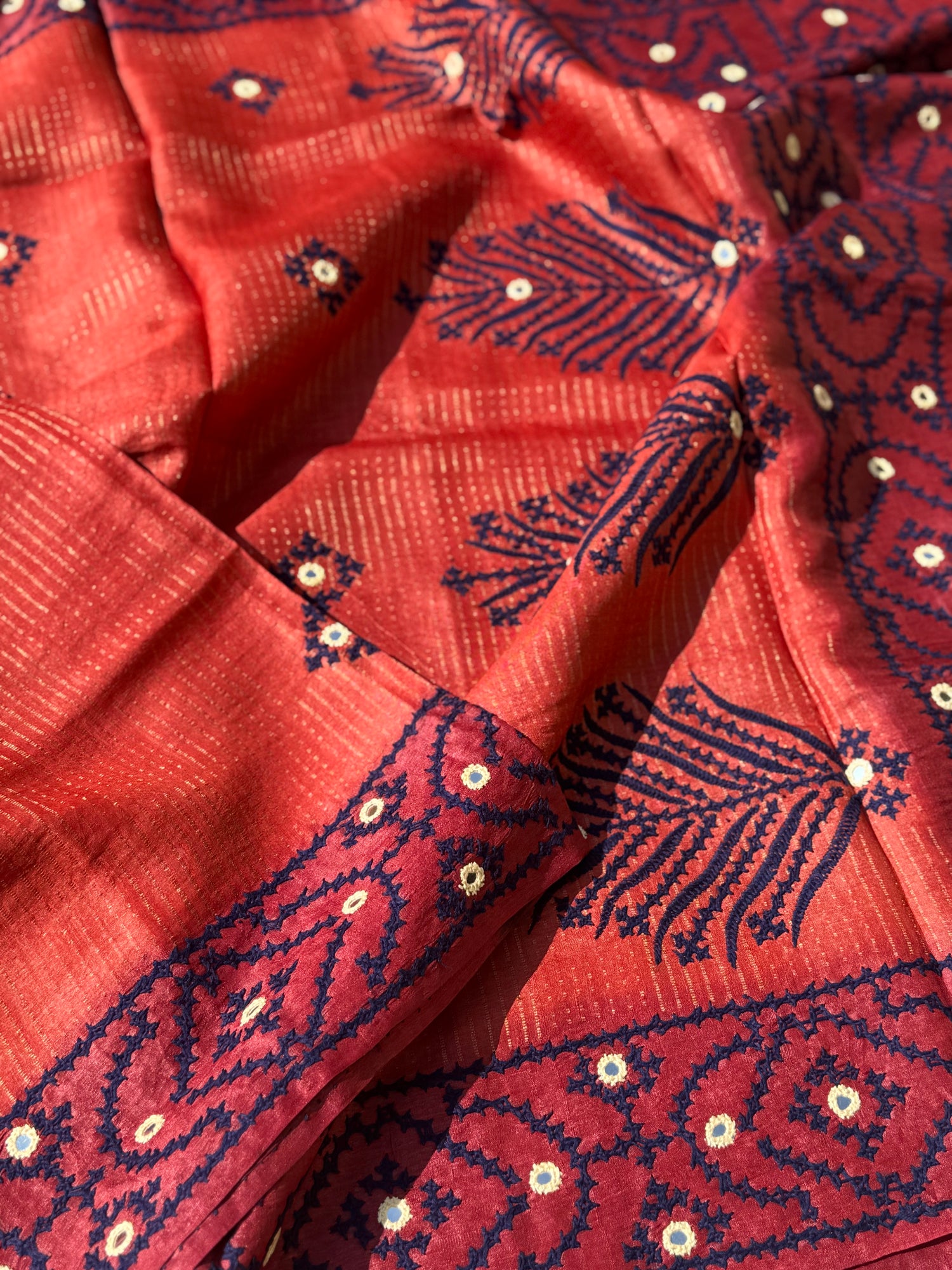 Brick red handwoven Tussar silk saree with handmade kutch mirror embroidery work