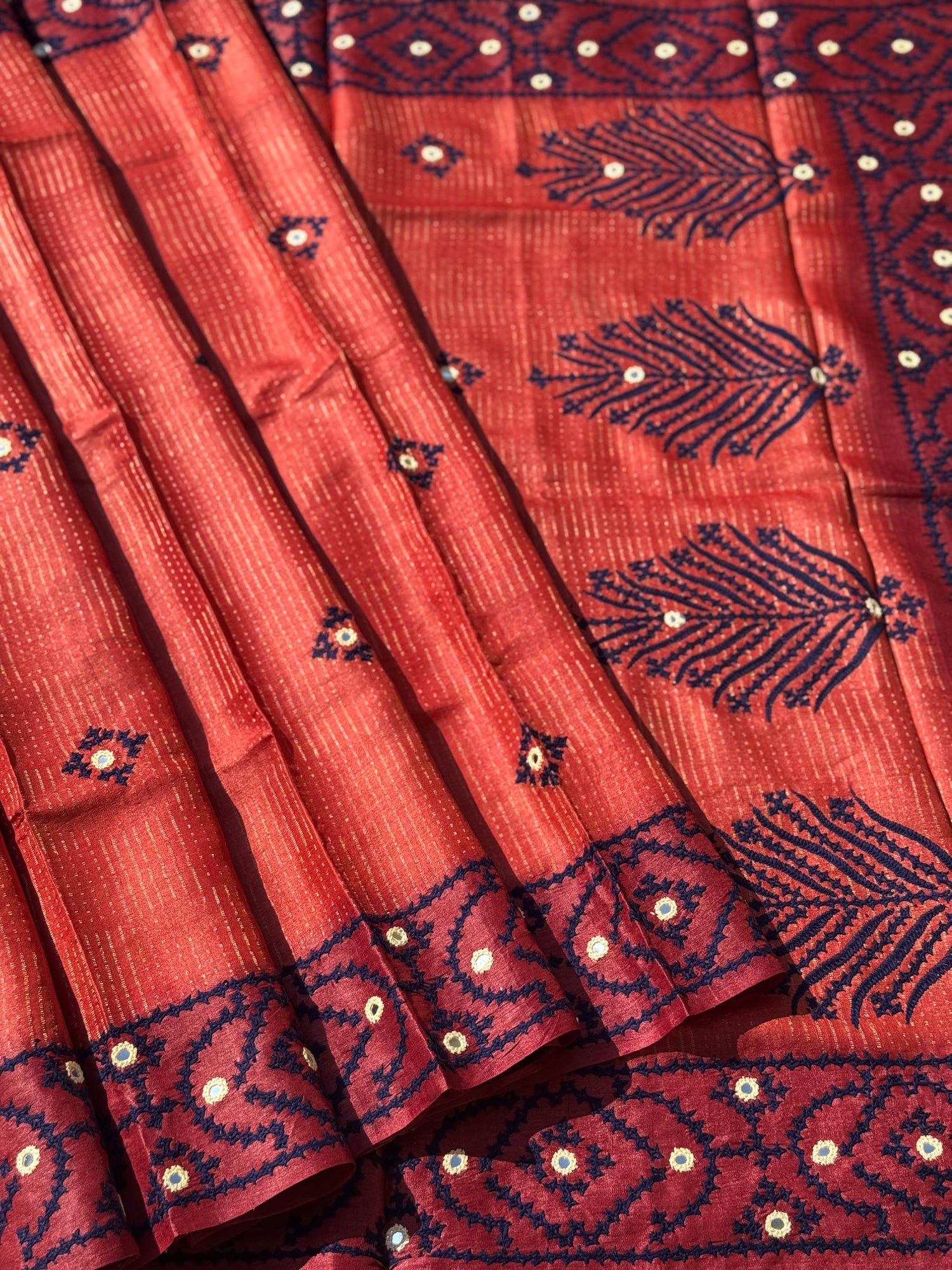 Brick red handwoven Tussar silk saree with handmade kutch mirror embroidery work