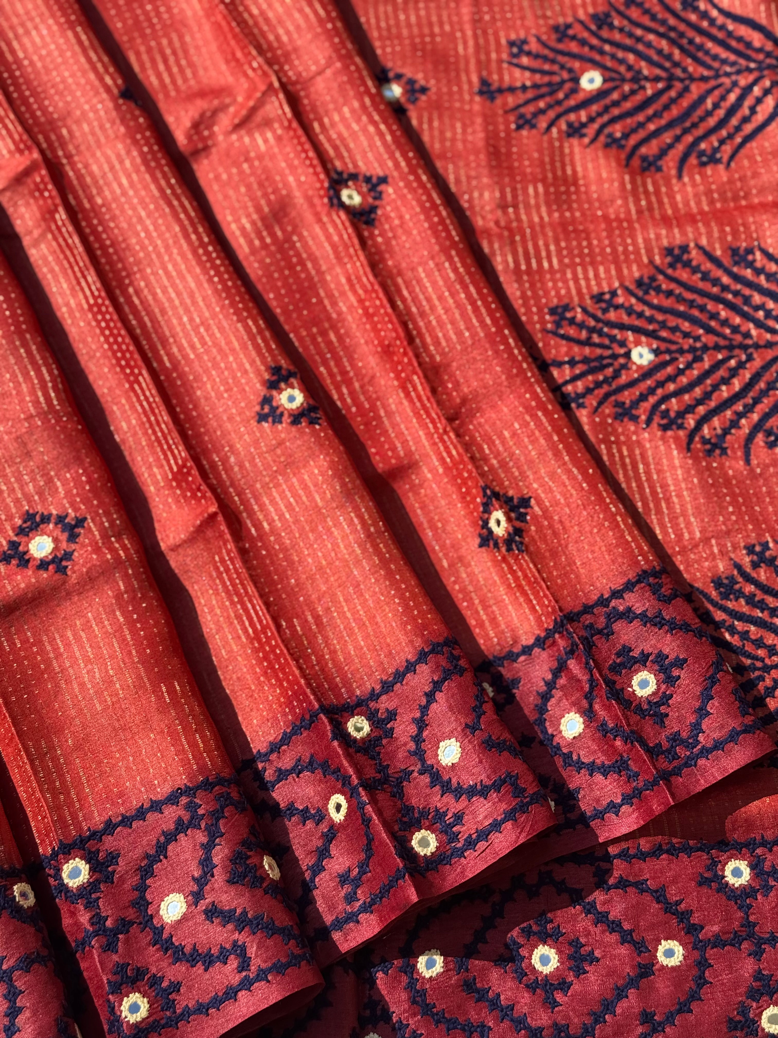 Brick red handwoven Tussar silk saree with handmade kutch mirror embroidery work