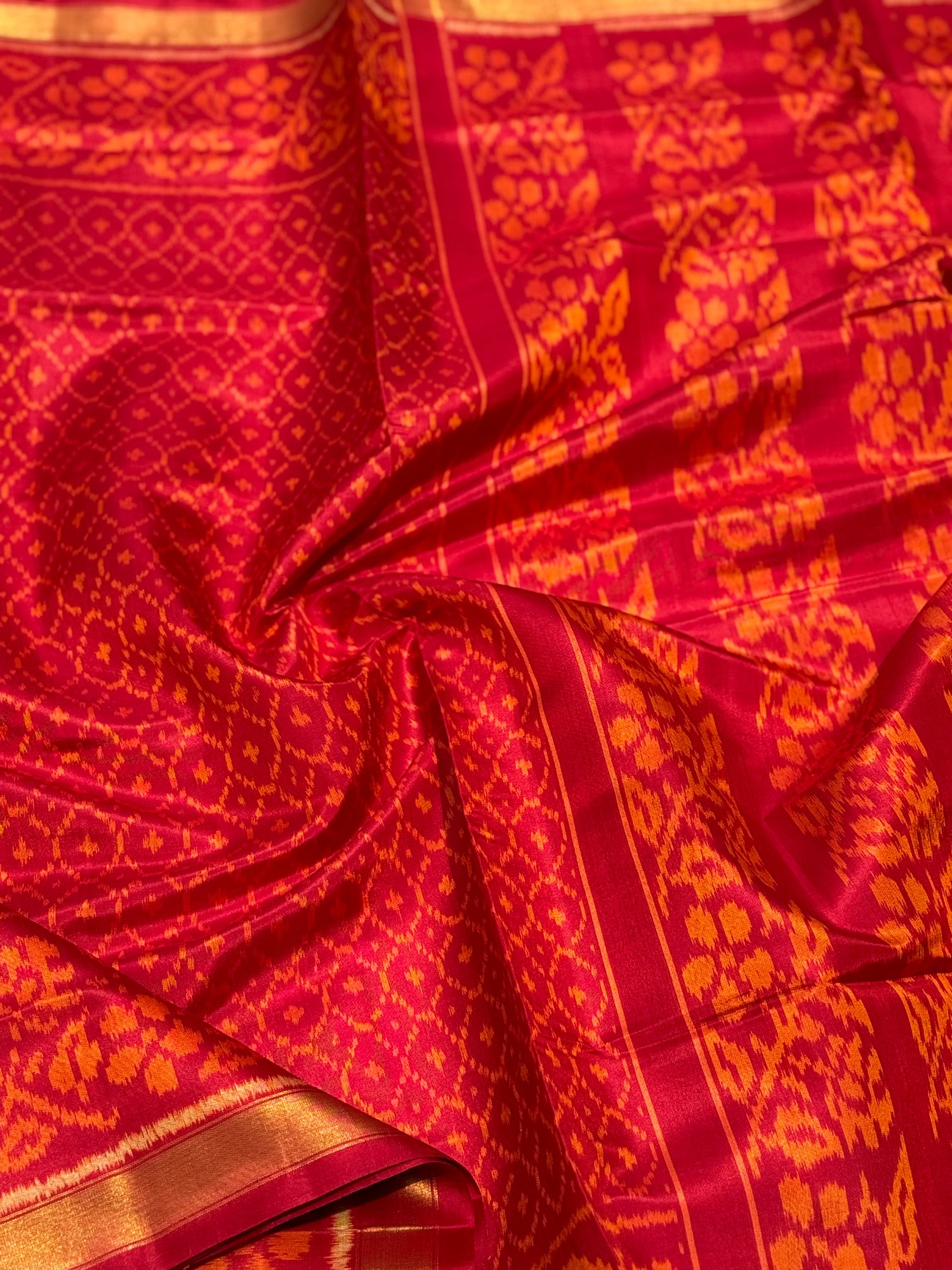 A gorgeous burnt orange with red shade single ikkat patola silk SAREE