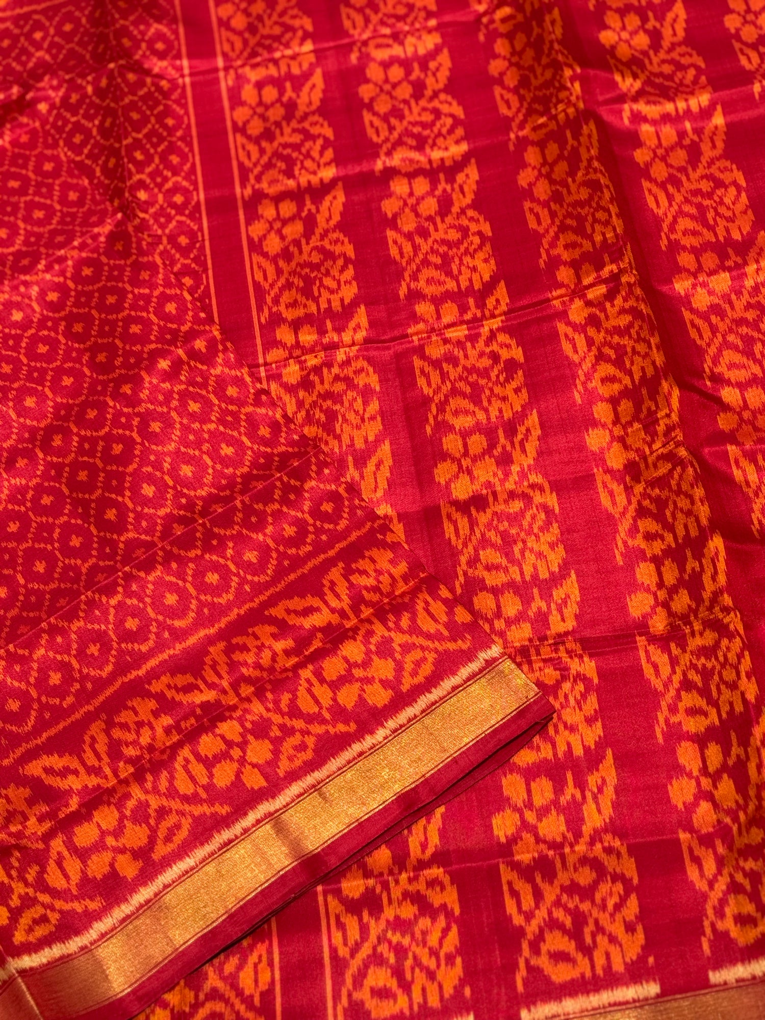 A gorgeous burnt orange with red shade single ikkat patola silk SAREE