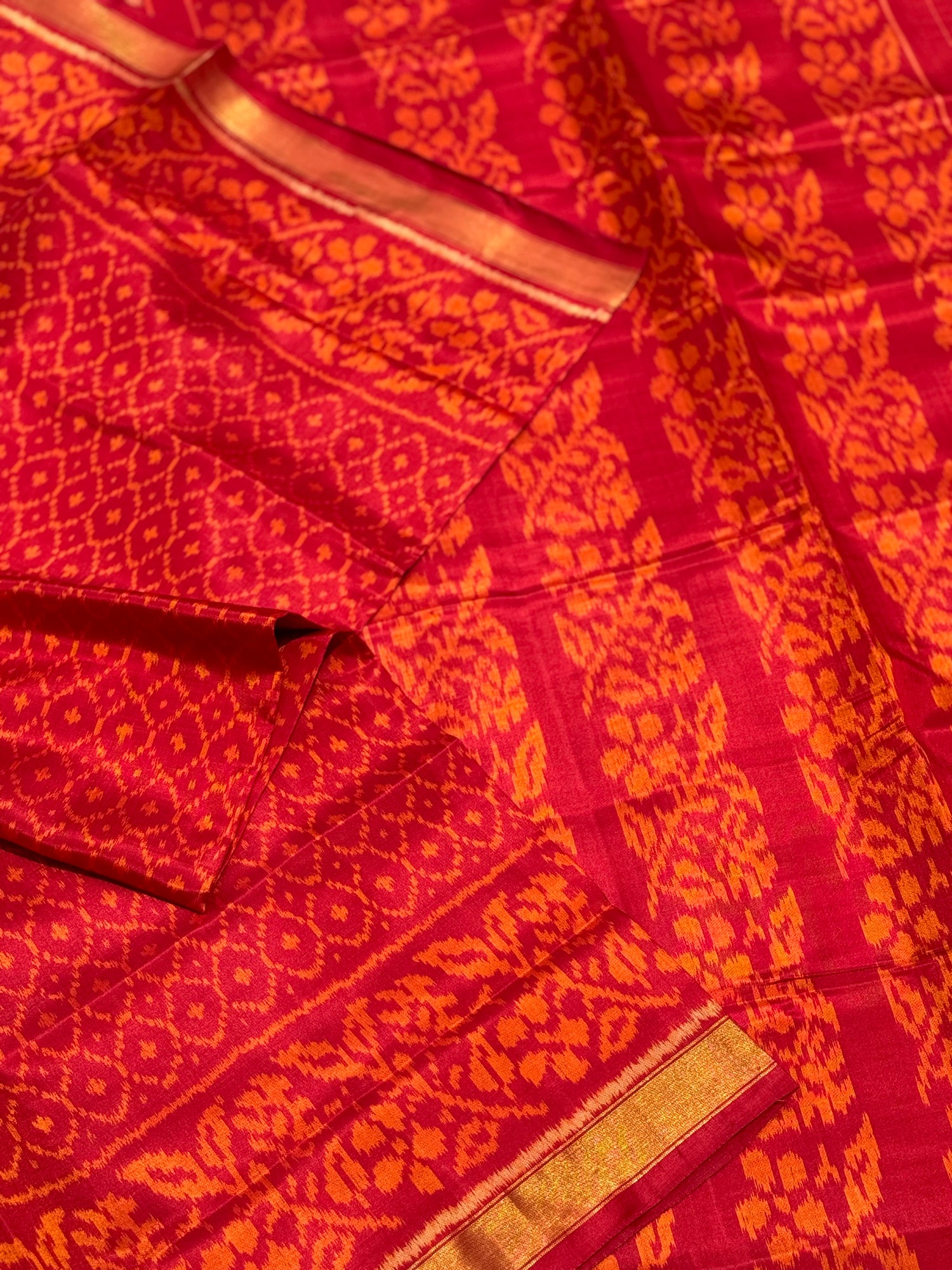 A gorgeous burnt orange with red shade single ikkat patola silk SAREE