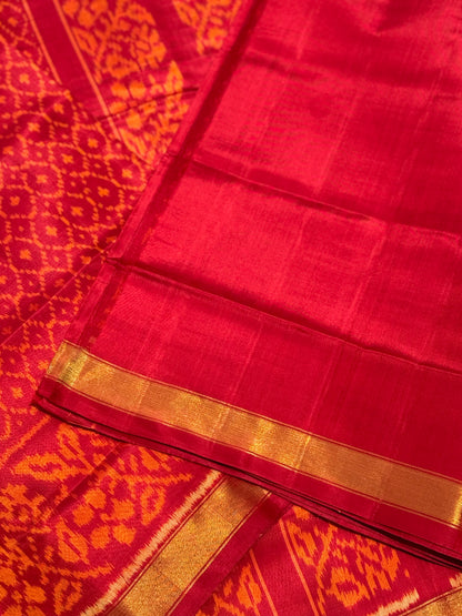 A gorgeous burnt orange with red shade single ikkat patola silk SAREE