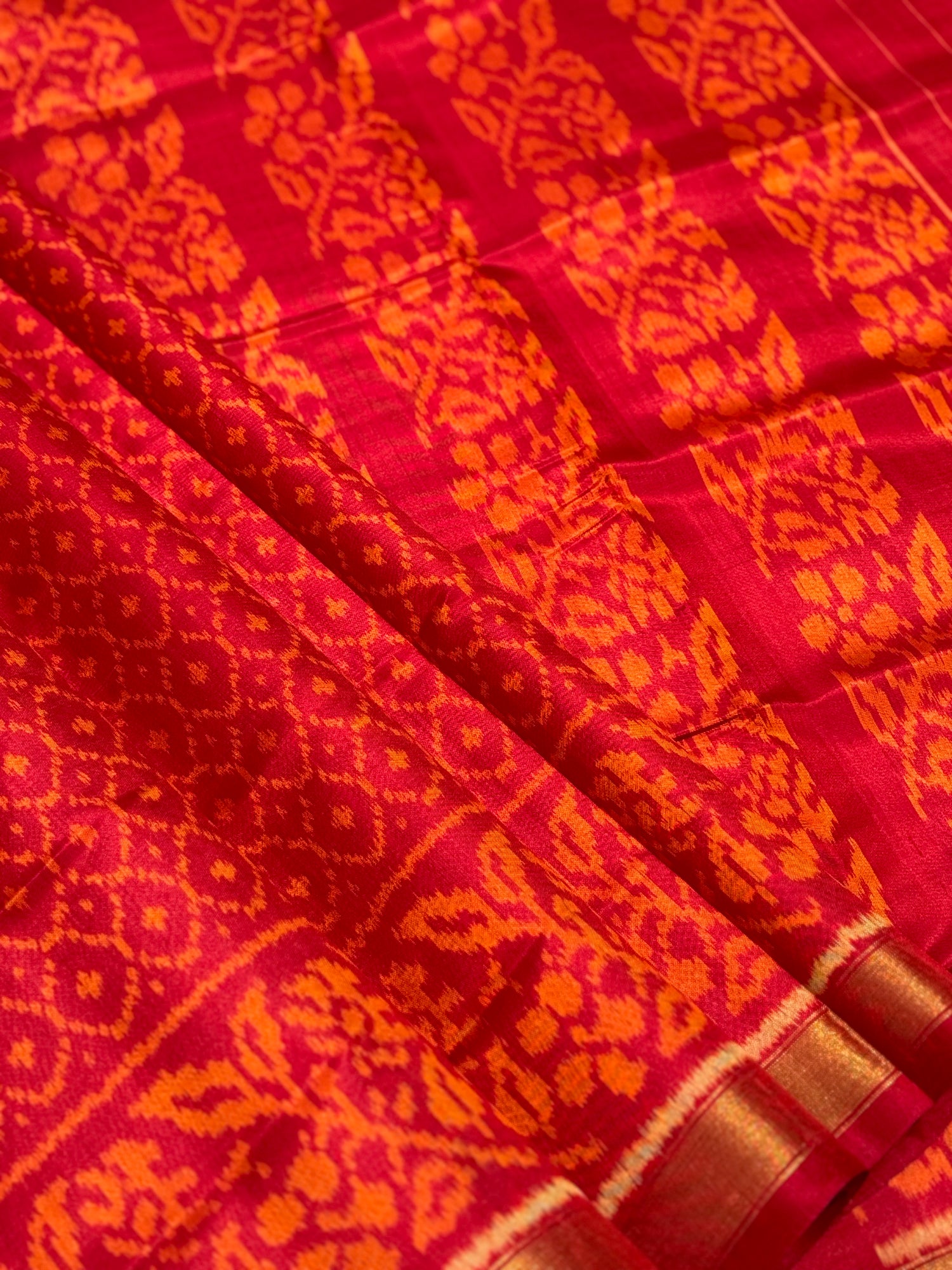 A gorgeous burnt orange with red shade single ikkat patola silk SAREE