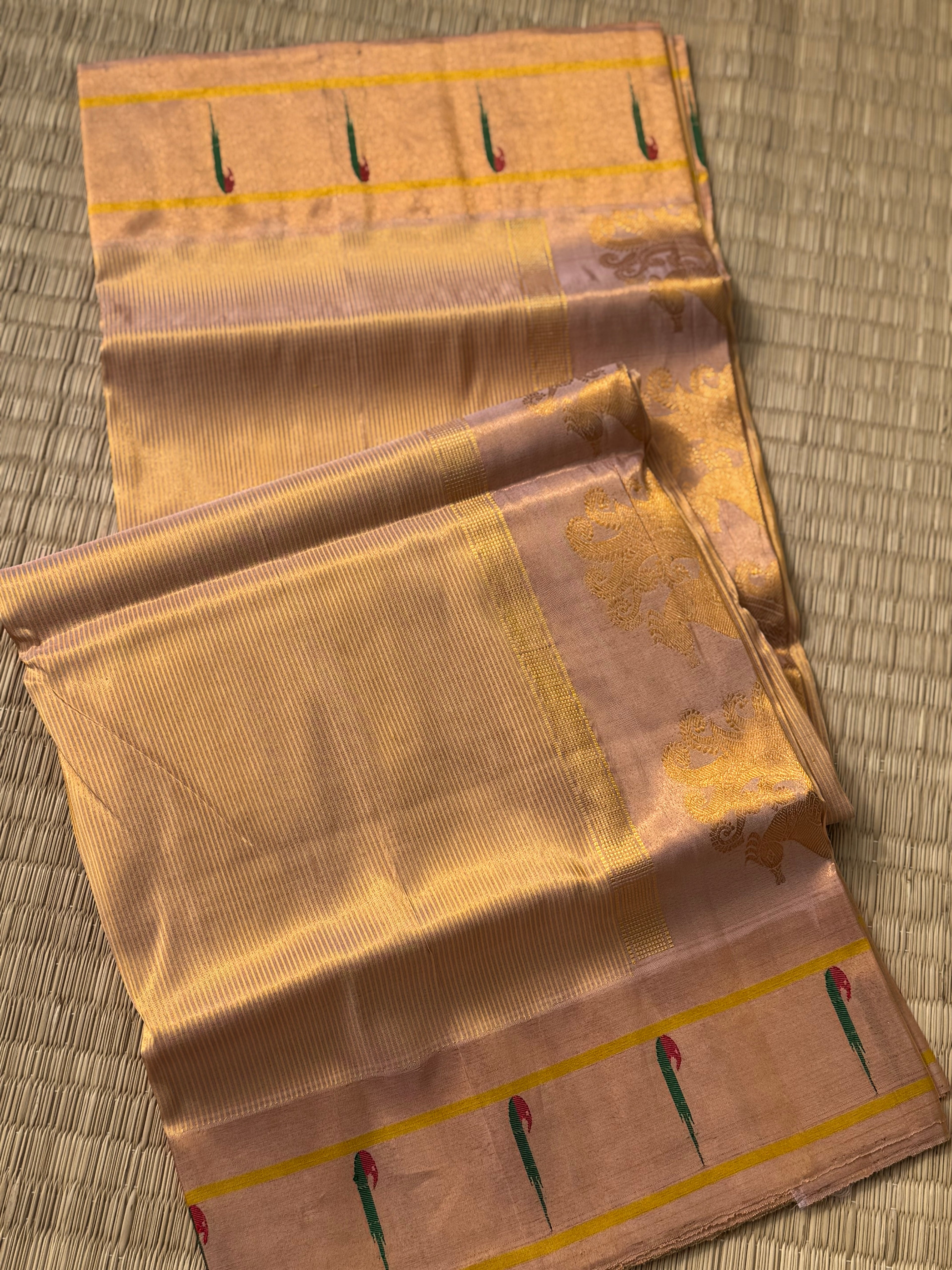 A stunner showstopper Handloom paithani tissue silk saree with single muniya border