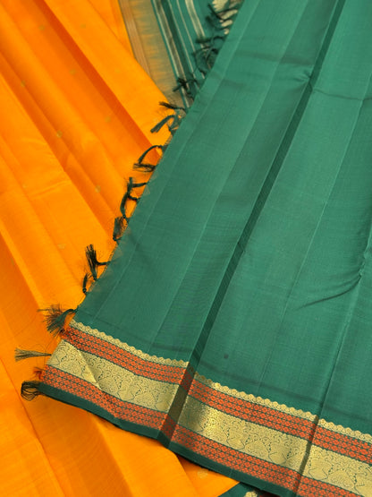 A Masterpiece kanchivaram korvai silk saree in mambazha yellow and bottle green