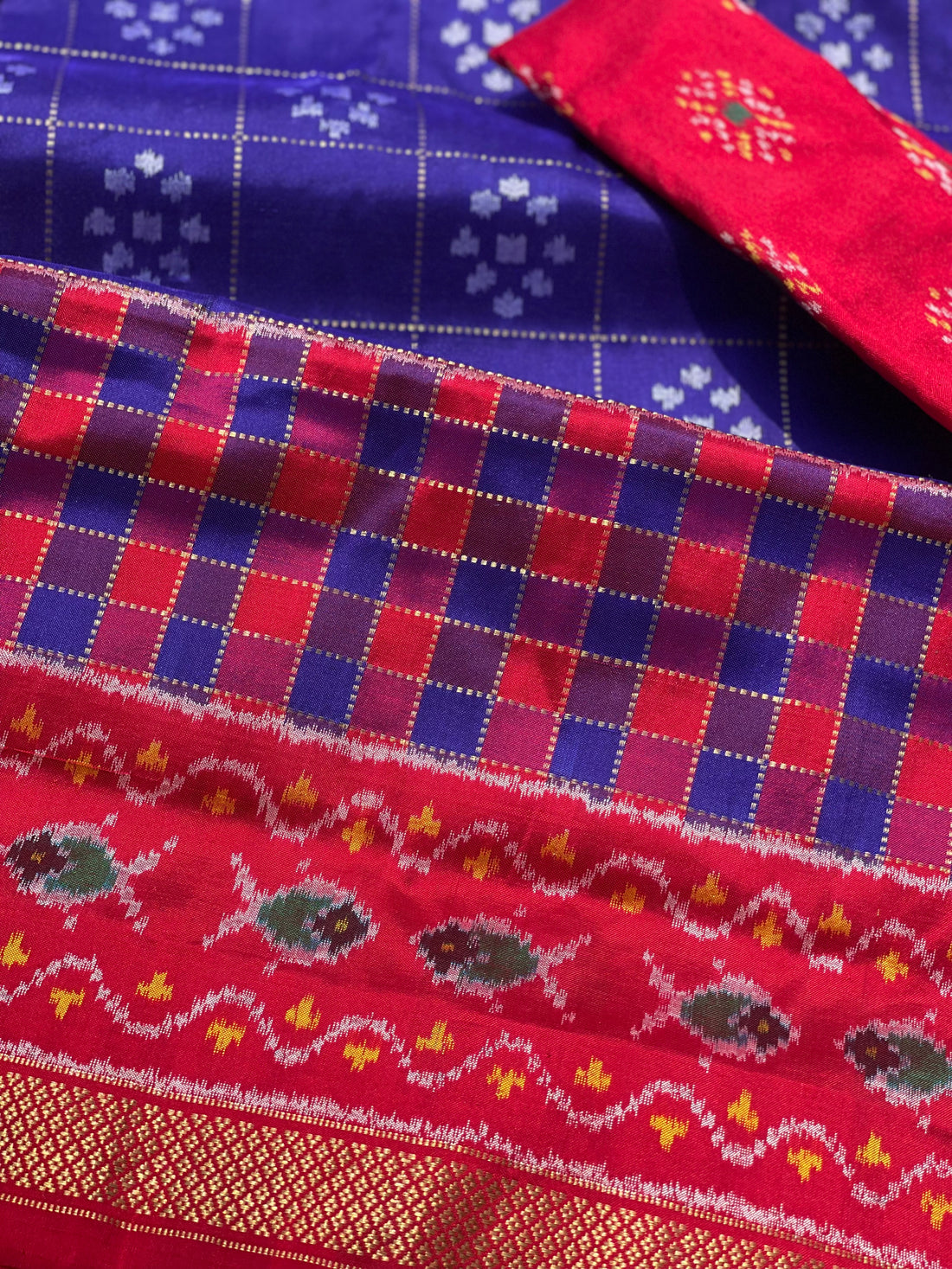 A purple blue and red silk ikkat saree with vintage kanchivaram Pettu border