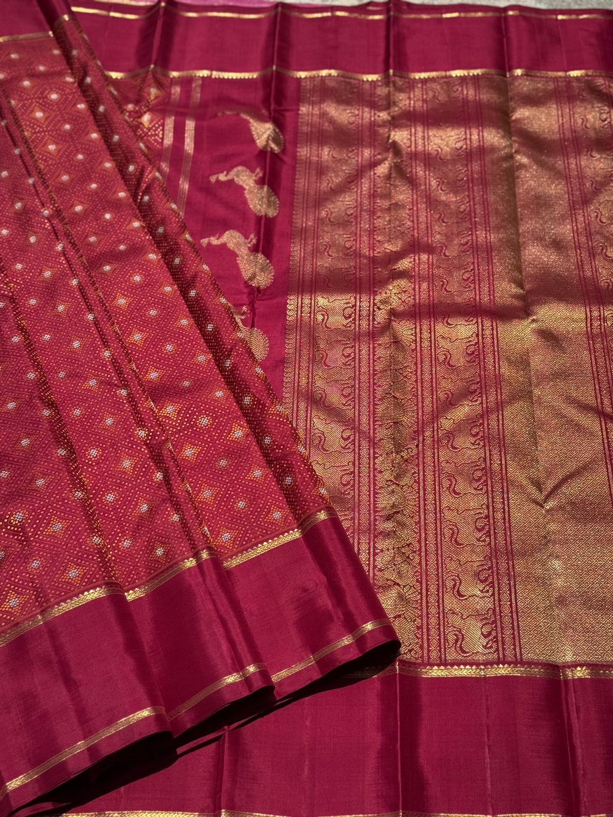 An epitome masterpiece arakku shade bhandini inspired kanchivaram silk saree masterpiece