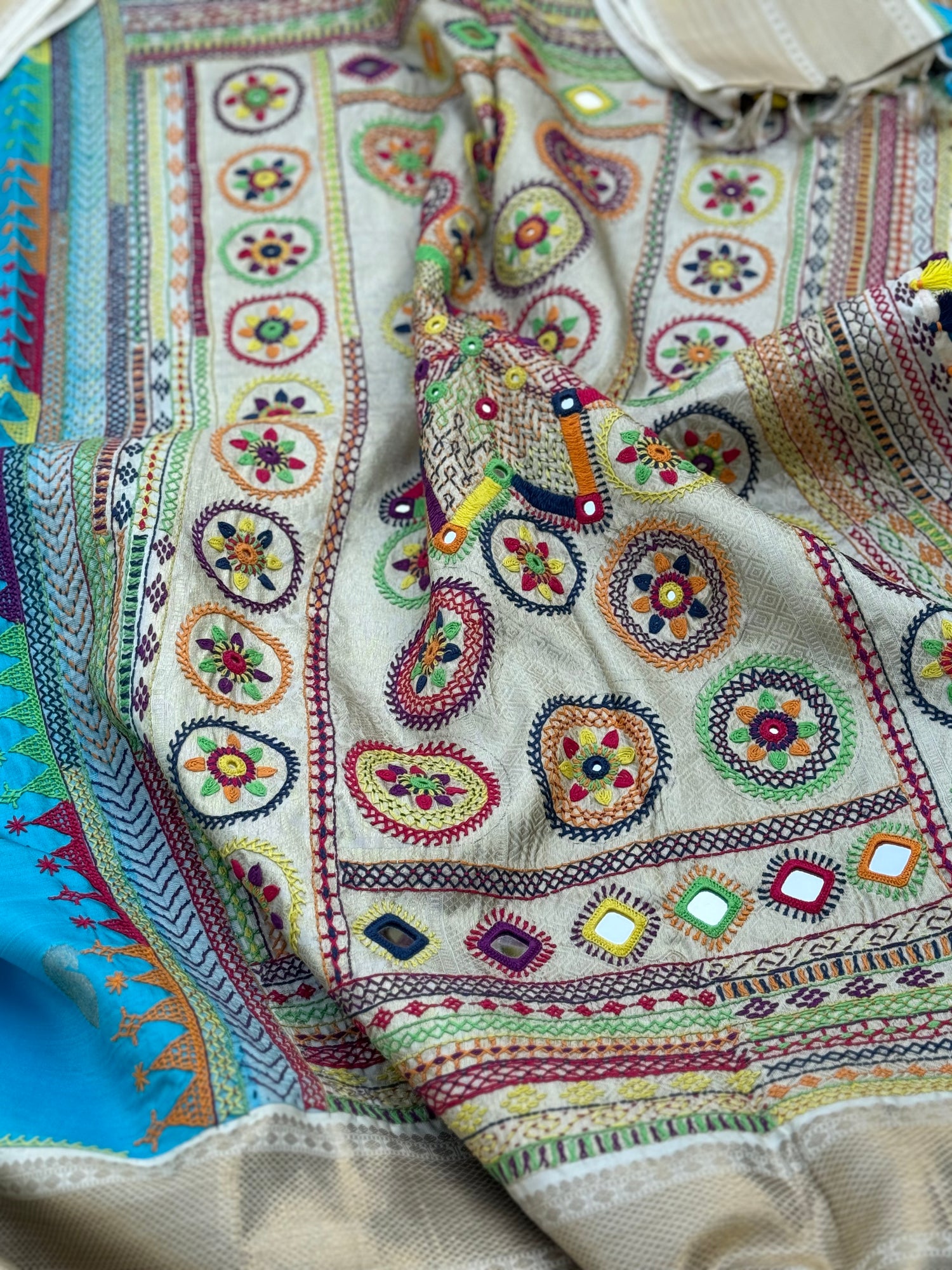 handwoven pure kanchivaram silk saree with korvai borders adorned with an exquisite handmade lambani mirror work