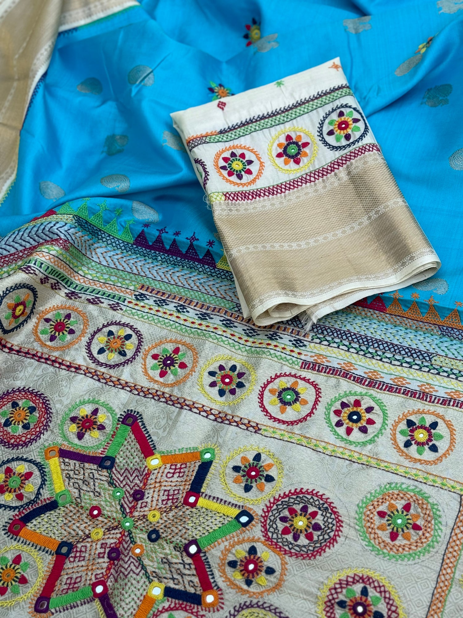 handwoven pure kanchivaram silk saree with korvai borders adorned with an exquisite handmade lambani mirror work